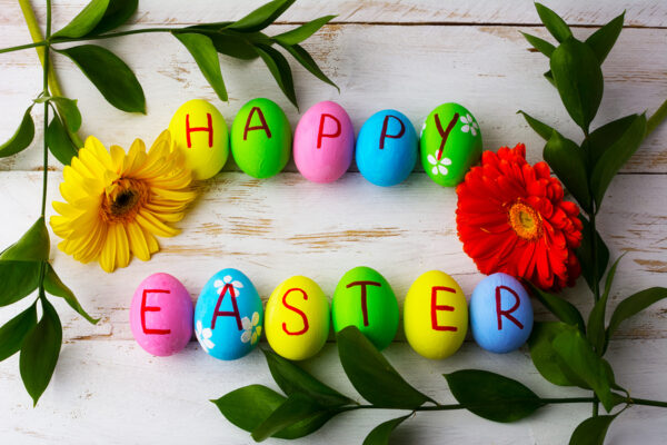 Easter Eggs On A White Wooden Background